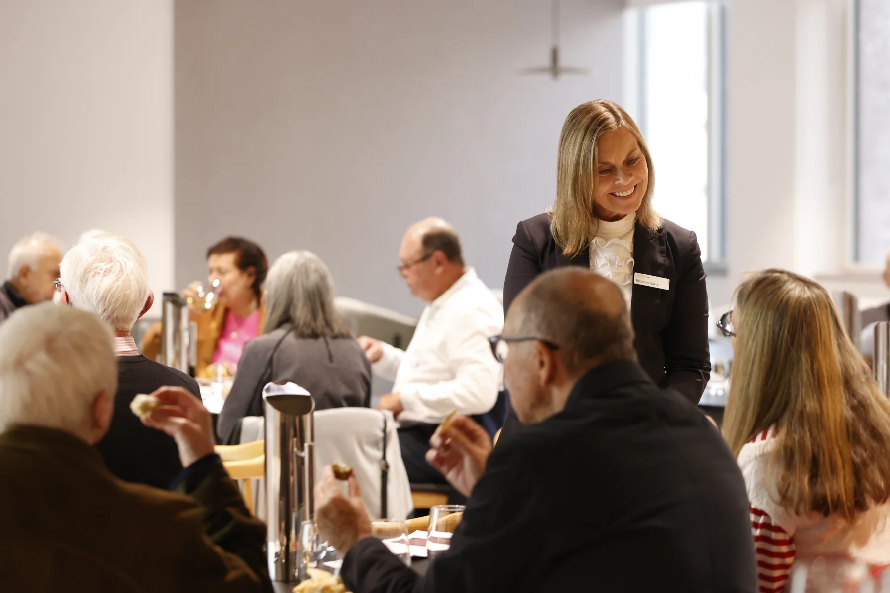 An Alteris adviser speaking with guests at a client event