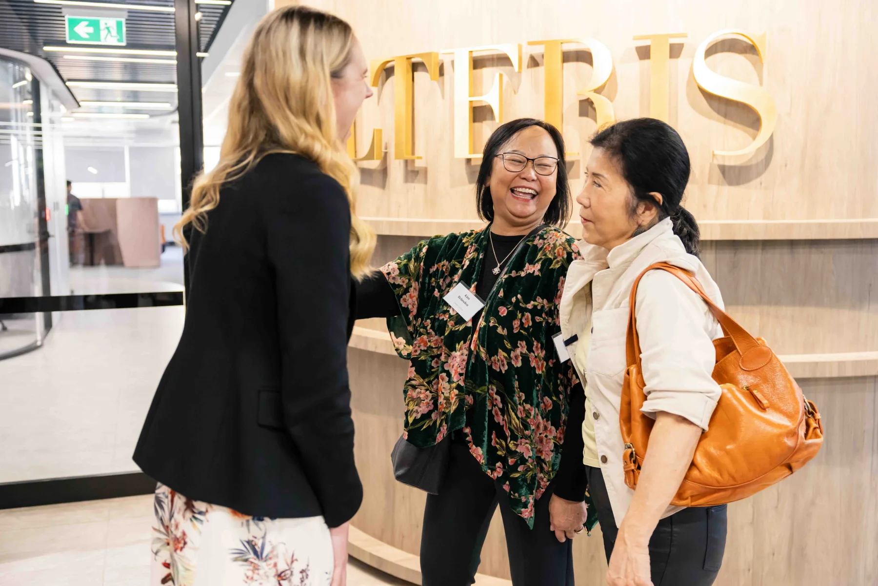 An Alteris team member welcoming guests in the Sydney office