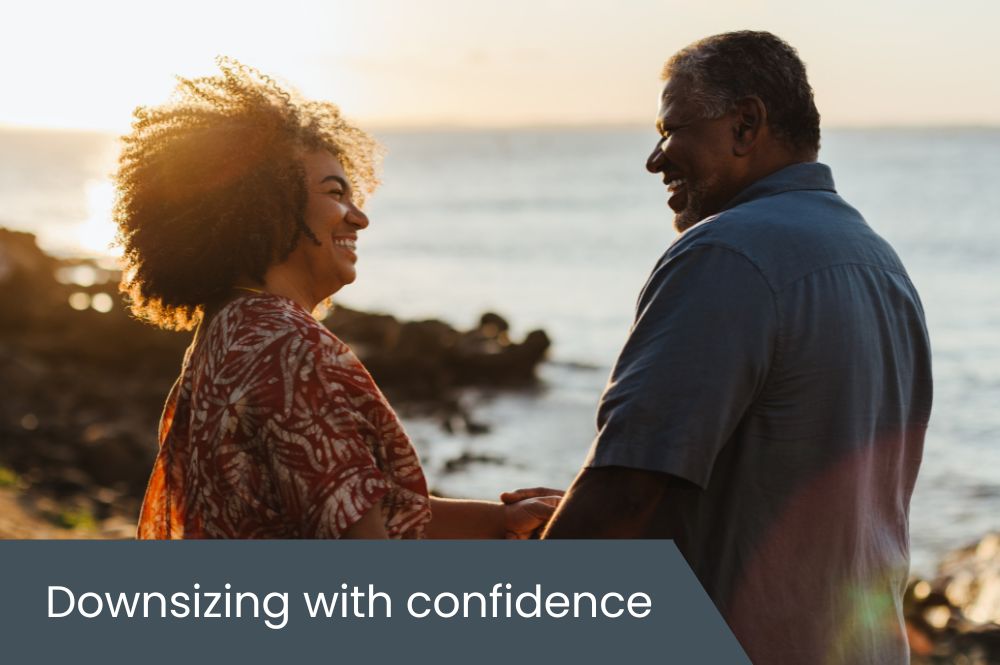 Downsizing with confidence Couple enjoying the beach at sunset