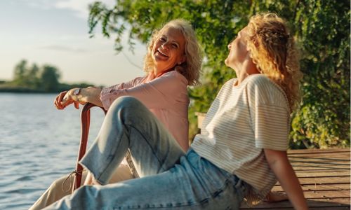 Women laughing on pier