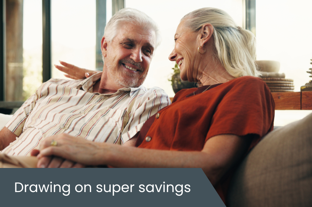 Drawing on super savings Retirement age couple laughing on couch