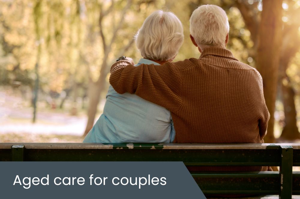 Aged care for couples Elderly couple sitting on park bench