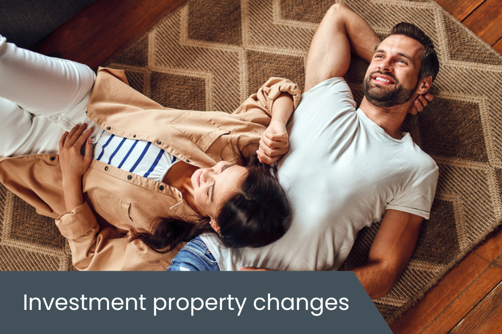 Investment property changes Couple laying on floor in their home