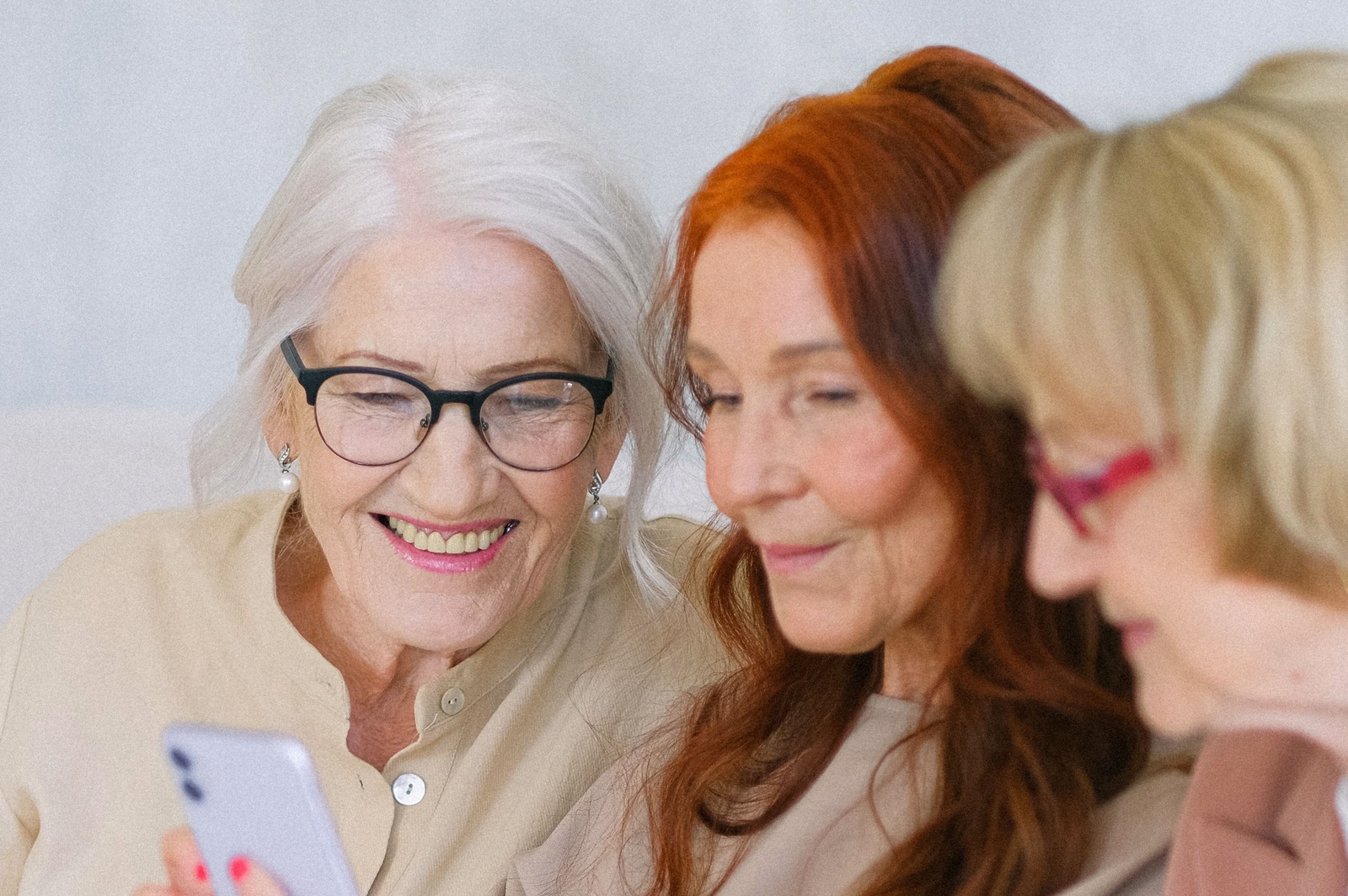 Elderly happy women browsing internet while searching for information