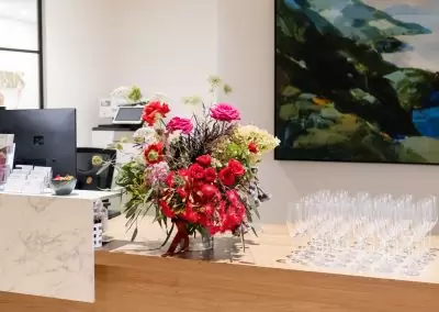 flowers and wine glasses on reception desk