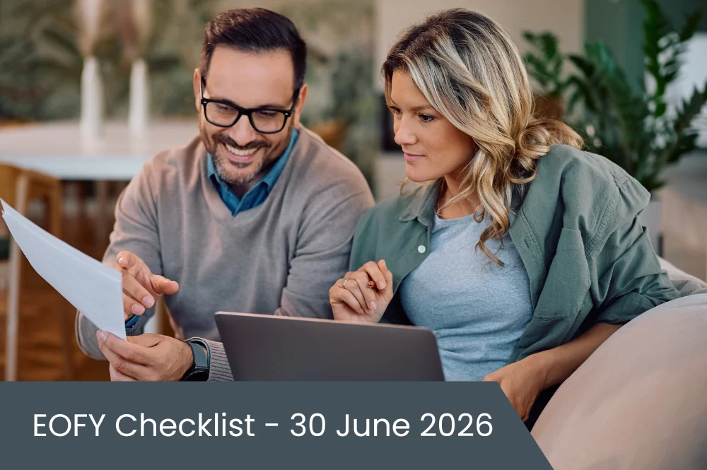 EOFY Checklist 30 June 2026 Couple sitting on couch doing taxes on paper and laptop