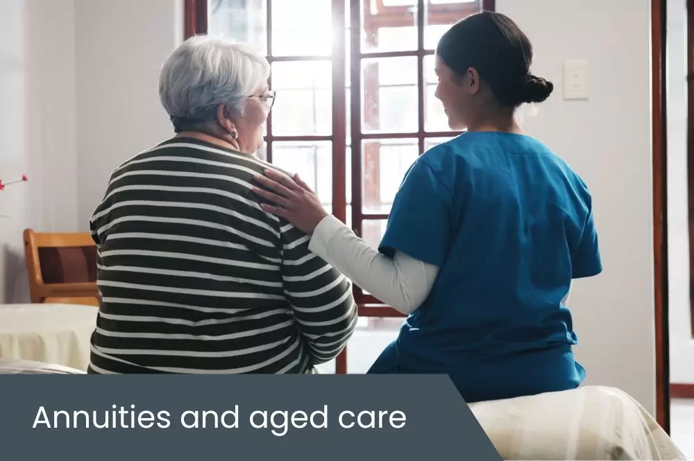 Annuities and aged care Elderly aged care resident sitting on bed with support worker