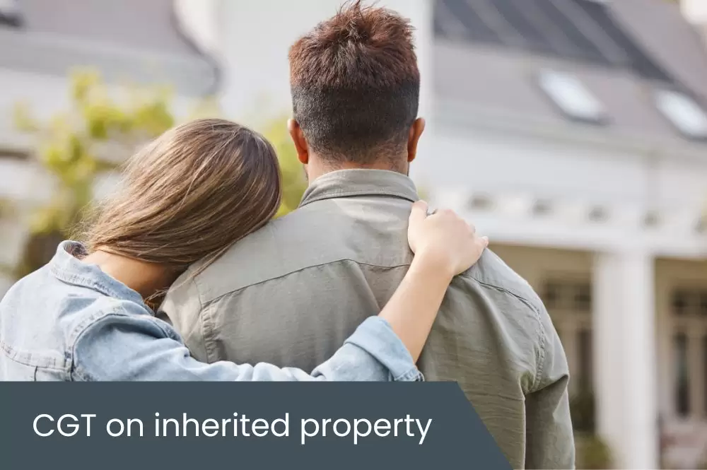 CGT on inherited property Couple standing outside property